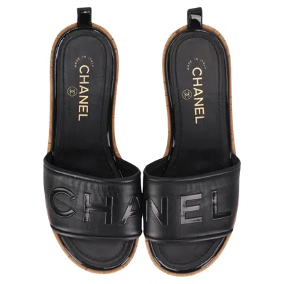 Pre-owned Chanel Logo Embossed Lambskin Cork Slides In Black