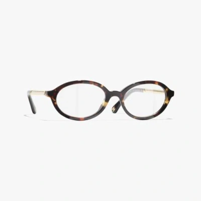 Chanel Oval Eyeglasses In Tortoise Tweed