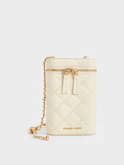 Charles & Keith - Mini Apfra Quilted Elongated Bag In Cream