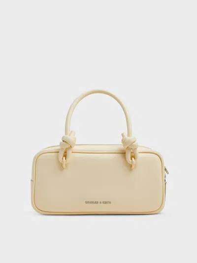 Charles & Keith - Sammie Knotted-handle Elongated Bag In Butter Yellow