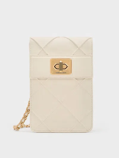 Charles & Keith Eleni Quilted Elongated Crossbody Bag In Cream