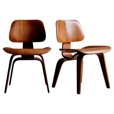 Pre-owned Charles And Ray Eames Set Of Two Eames Dcw Lounge Chairs In Walnut For Herman Miller, Usa, 1950s In Brown