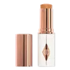Charlotte Tilbury Unreal Skin Sheer Glow Tint Hydrating Foundation Stick - 10 Tan