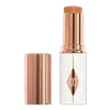 Charlotte Tilbury Unreal Skin Sheer Glow Tint Hydrating Foundation Stick - 11 Tan In Brown