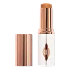 Charlotte Tilbury Unreal Skin Sheer Glow Tint Hydrating Foundation Stick - 12 Tan
