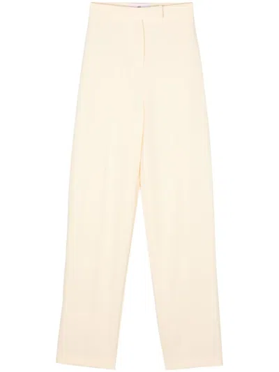 Chiara Ferragni Crepe Pressed-crease Tapered Trousers In Gelb