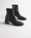 Chico's Lacquer Heel Stretch Boot In Black In Black