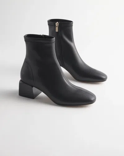 Chico's Lacquer Heel Stretch Boot In Black