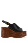 Chloé Maxime Black Wedge With Engraved Written Decorations And Logo Buckle In Leather Woman In Black