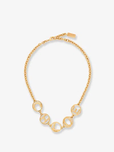 Chloé Brass Script Necklace In Gold