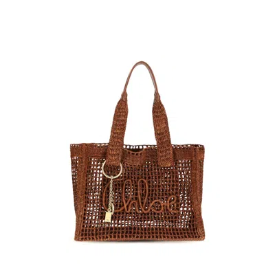 Chloé Tote Bag East-west Summer Banana In Rafia In Brown