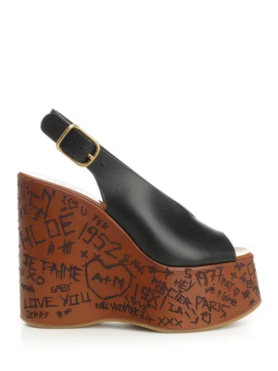 Chloé Maxime Black Wedge With Engraved Written Decorations And Logo Buckle In Leather Woman