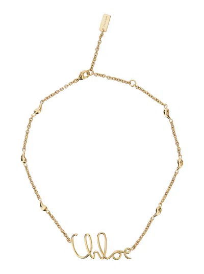 CHLOÉ CHLOÉ WOMEN GOLD COLORED NECKLACE WITH LOGO LETTERING IN BRASS WOMAN