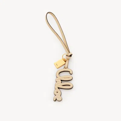 Chloé Logo Bag Charm In Shiny Leather In White