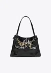 Chloé Logo Charms Patent Leather Hobo Bag In Black