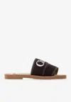 Chloé Woody Flat Logo Ribbon Slide Sandals In Black