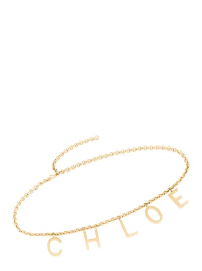 Chloé Metallic Belt With Adjustable Hook Closure And Logo Lettering Charm In Brass Woman In Gold