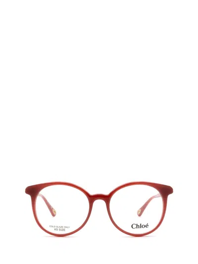 Chloé Round Frame Glasses In 004 Orange Orange Transpa