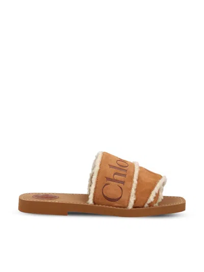 Chloé Woody Logo-embellished Shearling Sandals In Brown