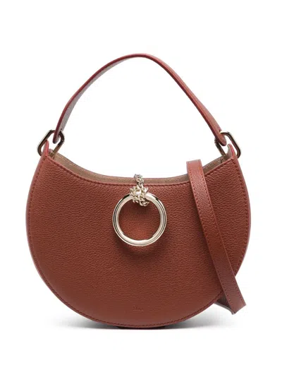 Chloé Round Leather Crossbody Bag With Ring Hardware In Brown