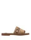 CHLOÉ WOODY FLAT SABOTS IN DARK TAN