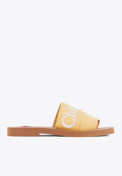 Chloé Woody Logo Embroidered Flat Slides In Yellow