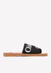 Chloé Woody Flat Logo Ribbon Slide Sandals In Black