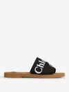 Chloé Woody Flat Logo Ribbon Slide Sandals In Black & White