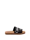 Chloé Woody Flat Logo Ribbon Slide Sandals In Black  