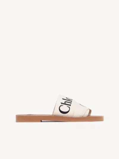 CHLOÉ CHLOÉ "WOODY" SLIDES IN LINEN AND LEATHER