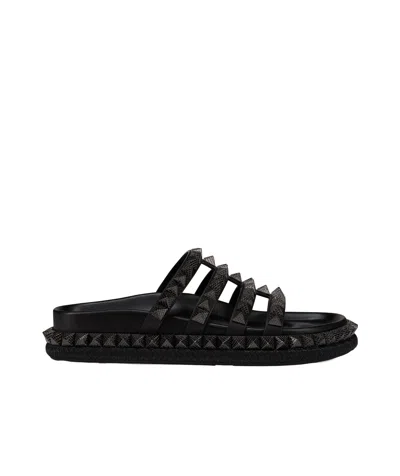 CHRISTIAN LOUBOUTIN CHRISTIAN LOUBOUTIN STUD EMBELLISHED SLIP-ON SANDALS