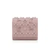 Christian Louboutin Spiked Compact Wallet In Neutral