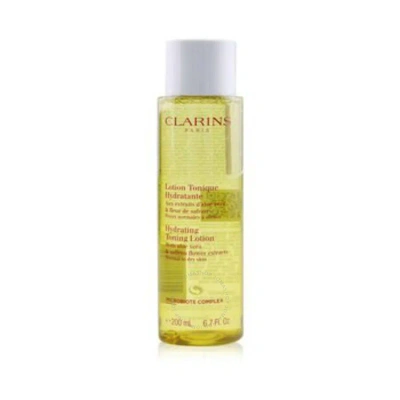 Clarins Hydrating Toning Lotion With Aloe Vera & Saffron Flower Extracts 6.7 oz Normal To Dry Skin S In White