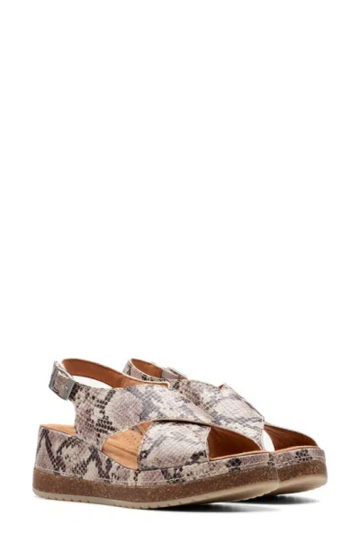 Clarks Kassanda Step Wedge Sandal In Beige Snake Print