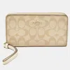 Coach Beige Siganture Coated Canvas And Leather Zip Around Wristlet Wallet In Sand