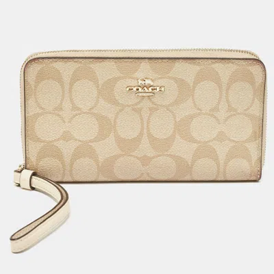Coach Beige Siganture Coated Canvas And Leather Zip Around Wristlet Wallet In Sand