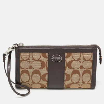 Coach /beige Signature Canvas And Leather Zip Wristlet Pouch In Brown