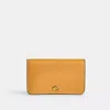 Coach In Brass/mustard Yellow