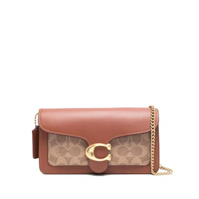 Coach Brown  Neutral Clutch Bags