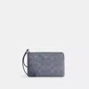 Coach Corner Zip Wristlet In Signature Canvas In Blue