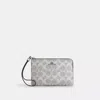 Coach Corner Zip Wristlet In Signature Canvas In Gray