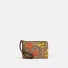 COACH CORNER ZIP WRISTLET IN SIGNATURE CANVAS WITH FLORAL PRINT