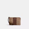 Coach Corner Zip Wristlet In Signature Canvas With Stripe In Brown