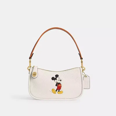 Coach Disney X  Swinger Bag In Regenerative Leather With Mickey Mouse In Brass/chalk Multi