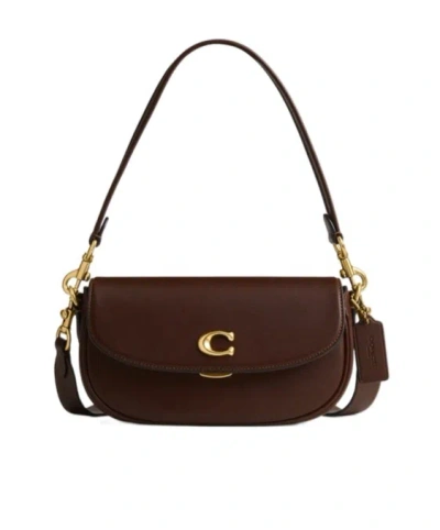 Coach Emmy Logo Plaque Saddle Bag In Brown