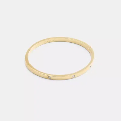 Coach Essential Hinged Bangle In Gold