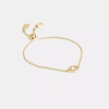 Coach Halo Round Slider Bracelet In Gold