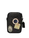 Coach Hitch Kuriertasche Mit Patch-print In Gray