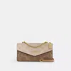 Coach Klare Envelope Crossbody Bag In Blocked Signature Canvas In Sand