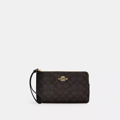 Coach Large Corner Zip Wristlet In Signature Canvas In Brown